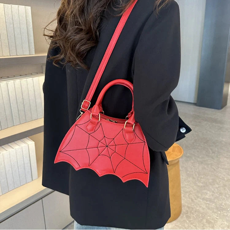 Trendy spider web-patterned shoulder bags in various colours, perfect for adding a spooky-chic touch to your Halloween outfit
