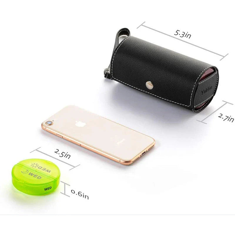 A black plastic 7-day pill organiser with rotating compartments and hidden storage for secure medication management