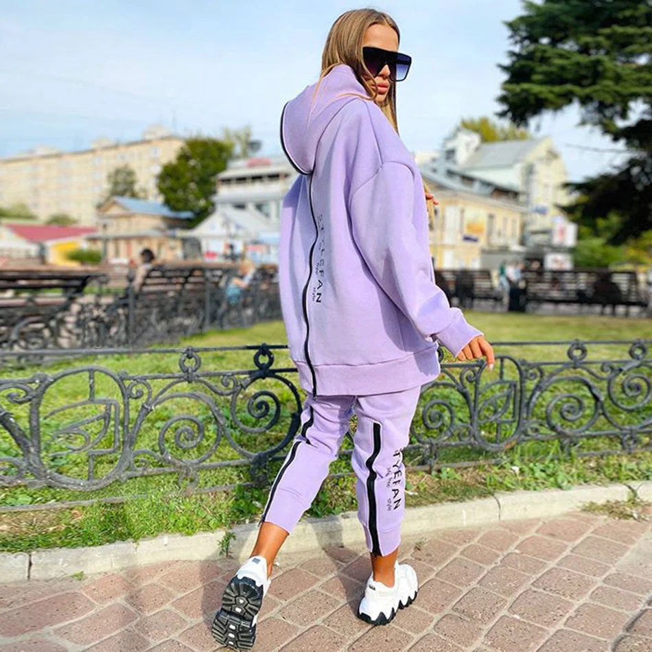 A stylish long hoodie jumpsuit in a variety of sophisticated colours, featuring a flattering silhouette and premium materials for all-day comfort.