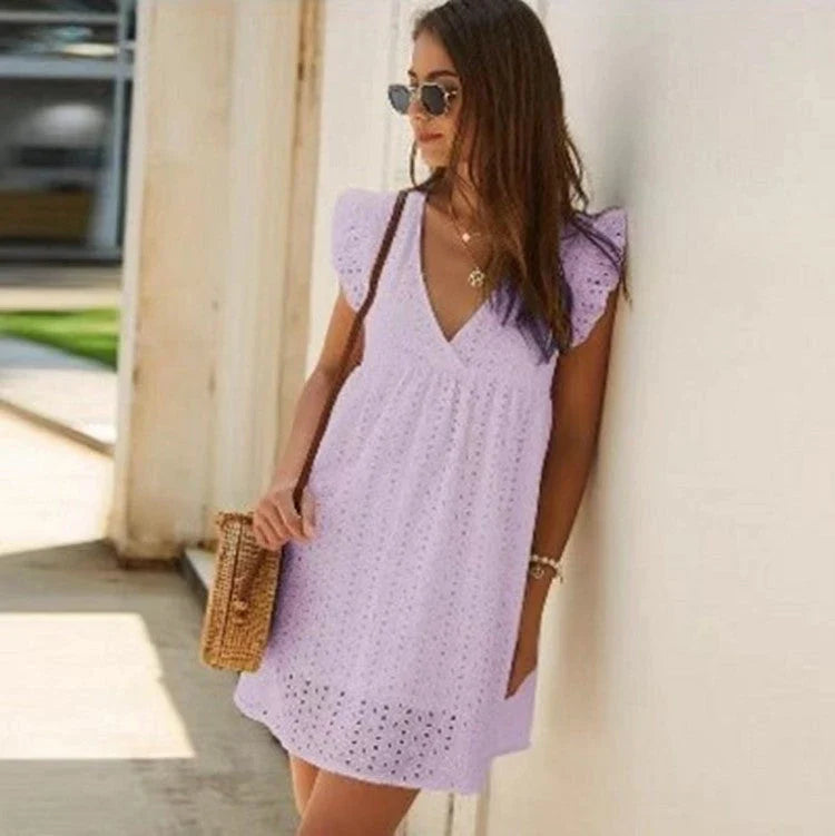A stylish cotton mini dress with a v-neck and ruffled sleeves, perfect for summer days and nights.