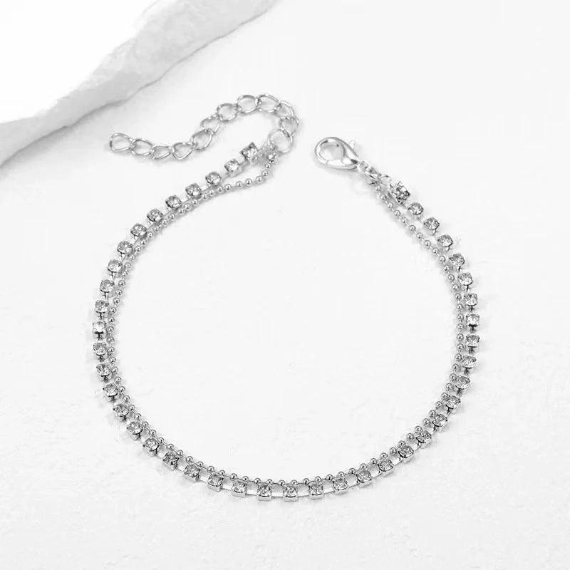 Stylish multi-layer beaded anklet necklace set with a geometric design in gold and silver tones