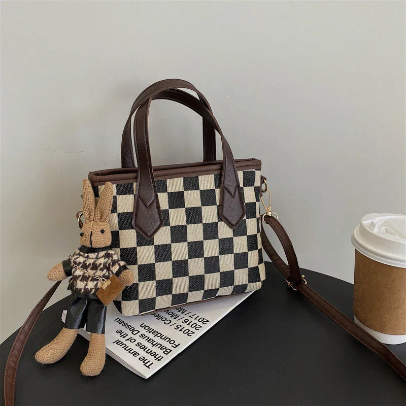 Stylish houndstooth shoulder bags in various colors, including black, coffee, and brown, with and without pendants, featuring a portable and versatile design for everyday use.