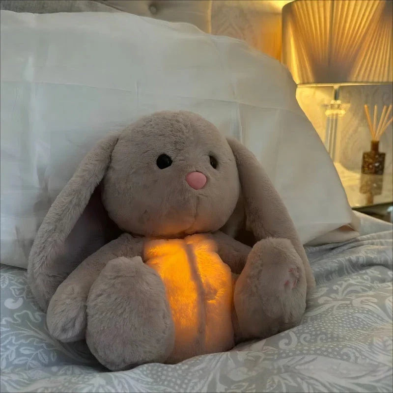A soft, plush rabbit toy with a breathing mechanism that mimics natural respiration to soothe and comfort newborns