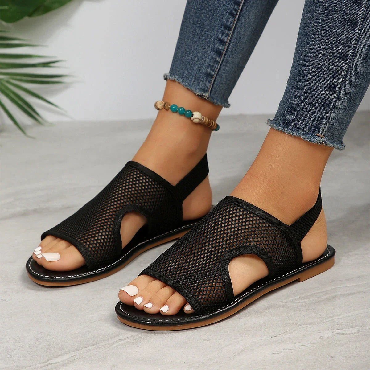 Breathable mesh sandals in various colors, featuring a lightweight design for summer comfort and style