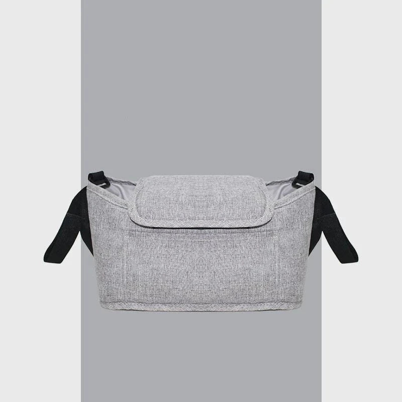Stylish baby pram organiser bag made of premium cotton and linen materials, featuring various compartments and colour options to keep your child's essentials organised.