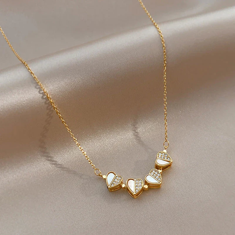 Luxe four-leaf clover pendant necklace crafted with stainless steel and crystal heart charm for women