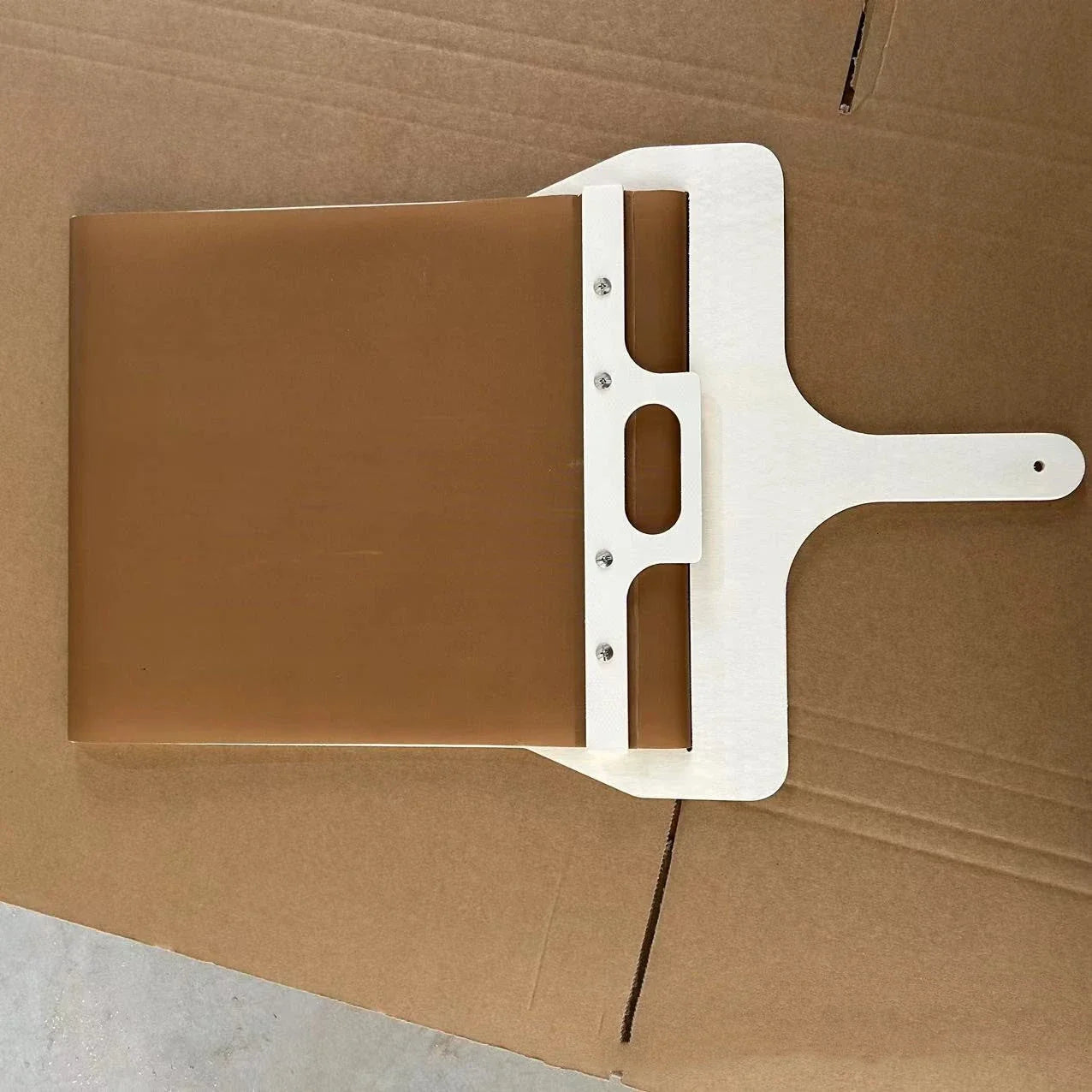Wooden pizza peel with various size options, perfect for transferring baked goods from oven to table