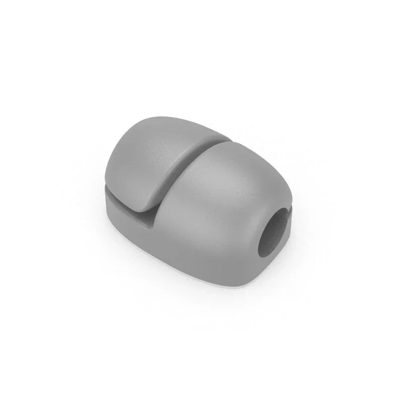 Premium silicone cable clips in various colours for organising and managing cables on desks, entertainment units, and other surfaces