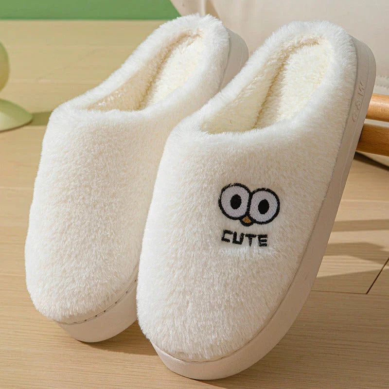 Cozy cartoon-themed slippers for couples, featuring plush material and non-slip rubber soles in a variety of vibrant colors.