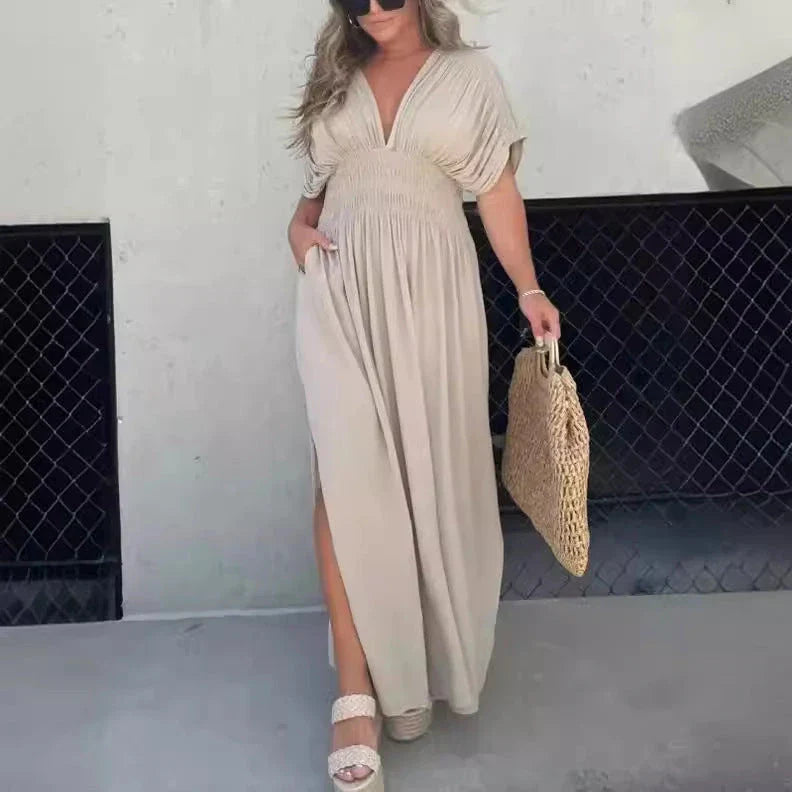 Chic bat-sleeve dress with v-neck, side slit, and elastic waist for comfortable summer style