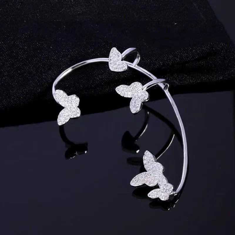 Sparkling butterfly-shaped ear cuffs with zirconia stones, available in gold and silver alloy finishes