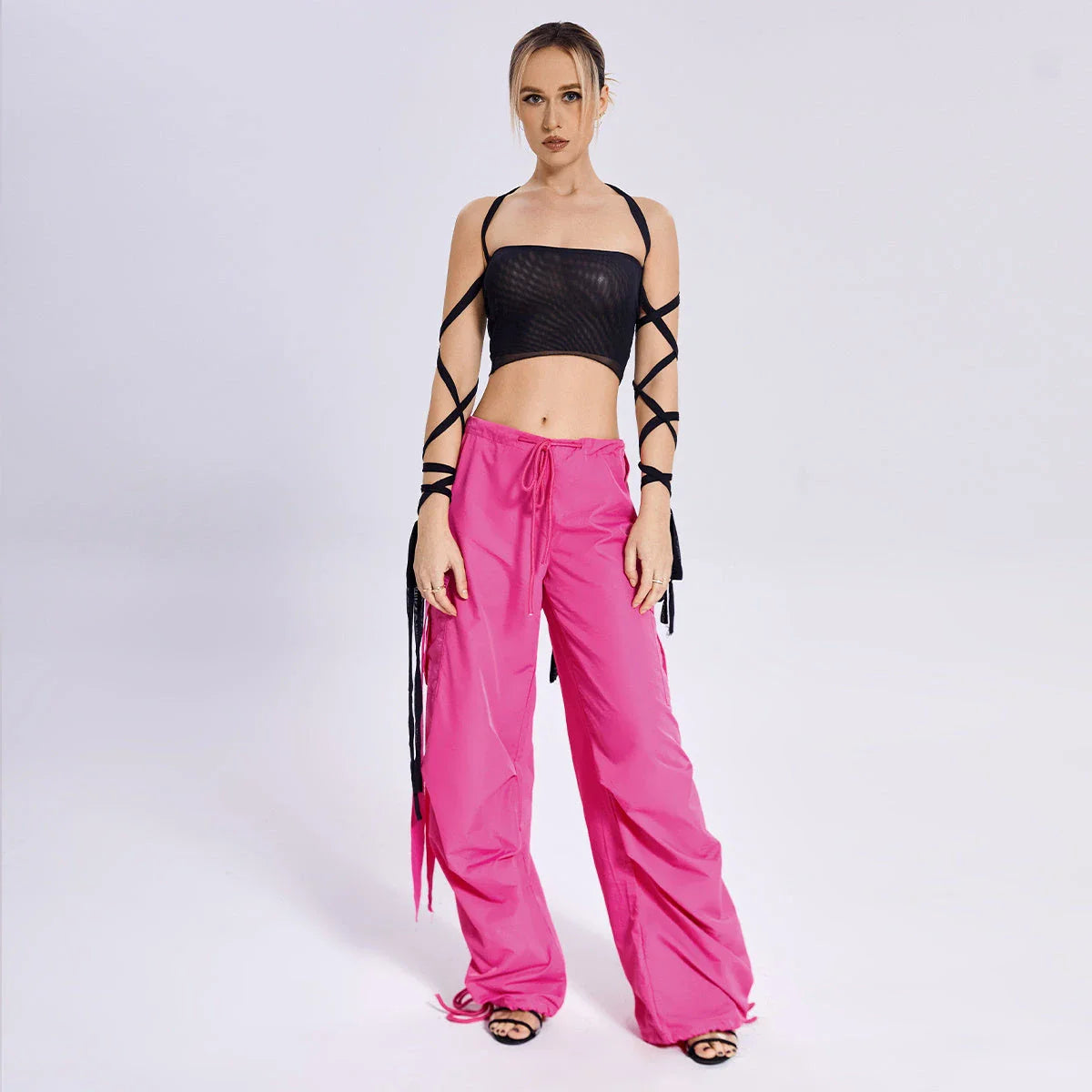 Stylish women's tank top with elastic cross-arm straps, available in black color