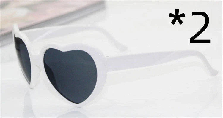Stylish heart-shaped sunglasses with unique lens design that transforms light into enchanting special effects