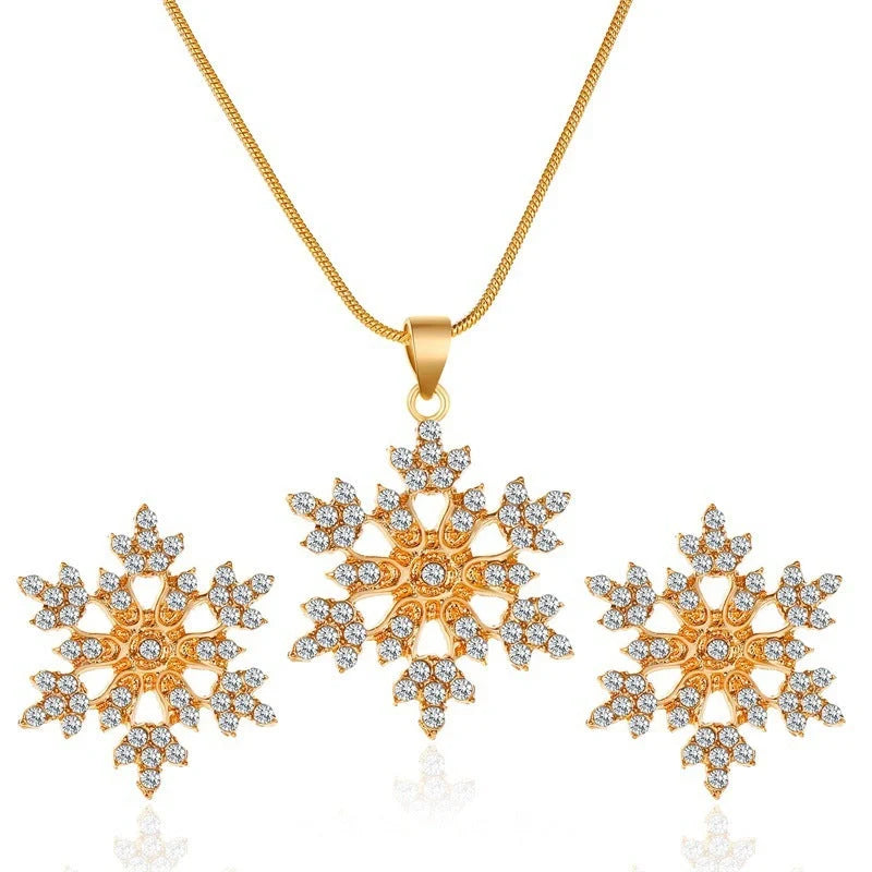 Elegant snowflake jewellery set with necklace, earrings and pendant in gold and silver tones