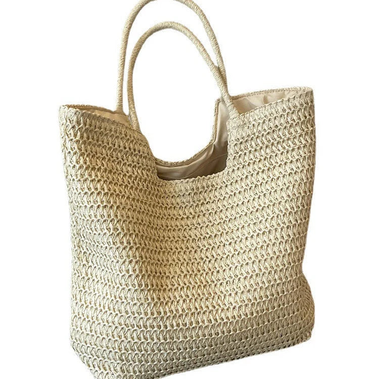 A stylish and spacious straw tote bag in brown and beige colours, perfect for British women on the go.