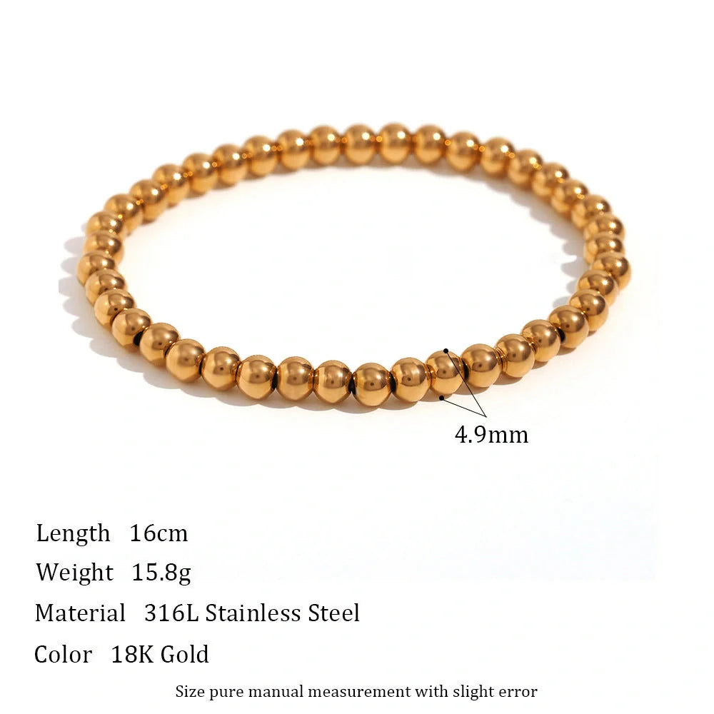 Vintage-inspired stainless steel and 18K plated elastic bead bracelet in a range of sizes and colours