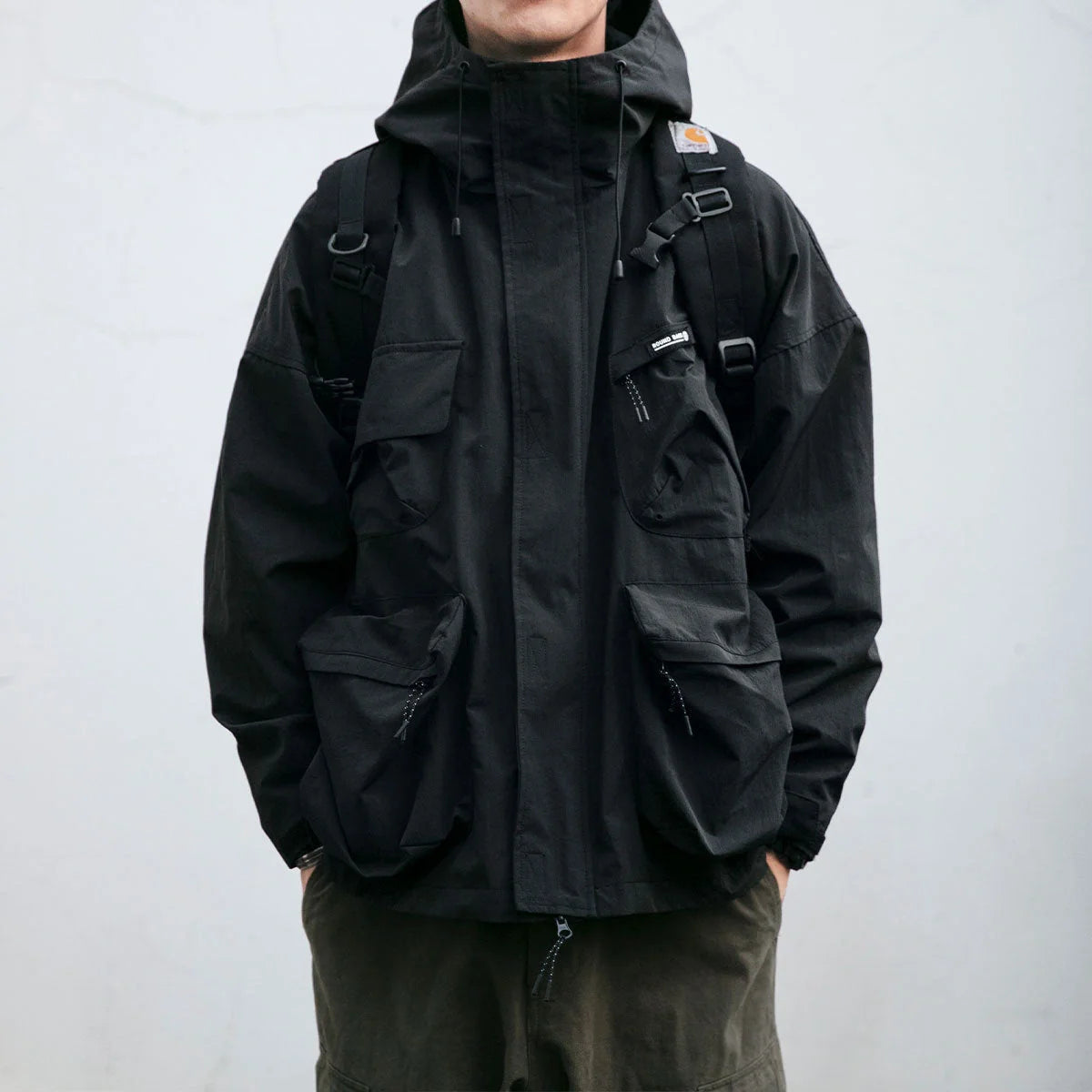 Men's hooded jacket in black, yellow, or green with windproof feature and three-dimensional pockets