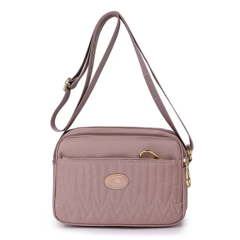 Women's lightweight nylon cross body messenger bag in various colours