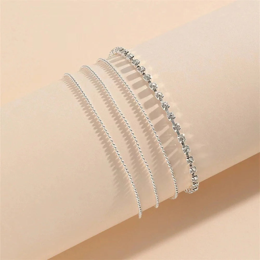Stylish multi-layer beaded anklet necklace set with a geometric design in gold and silver tones
