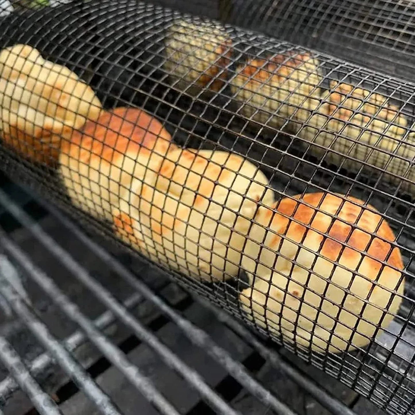 A stainless steel wire mesh grilling basket with a round shape, designed for versatile outdoor cooking and barbecue.