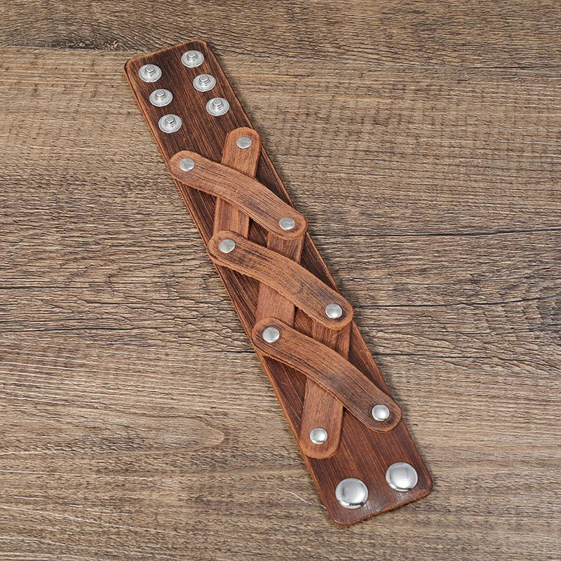 Vintage-inspired brown leather bracelet with geometric shapes and multi-layered design