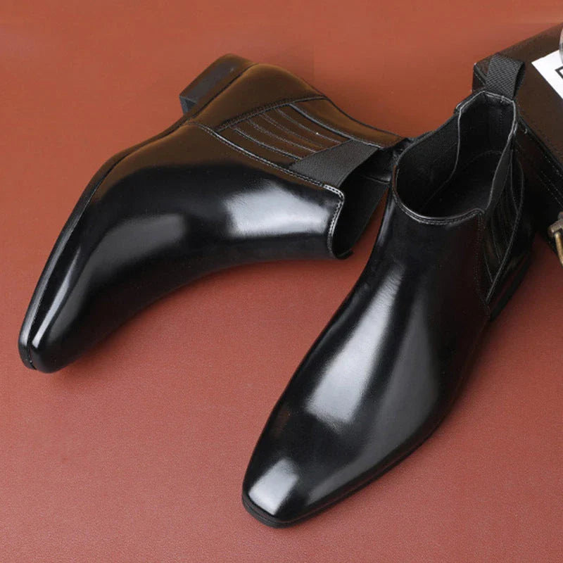 Stylish pointed toe Chelsea boots for men in black and brown colors, featuring a square heel and British-inspired design.