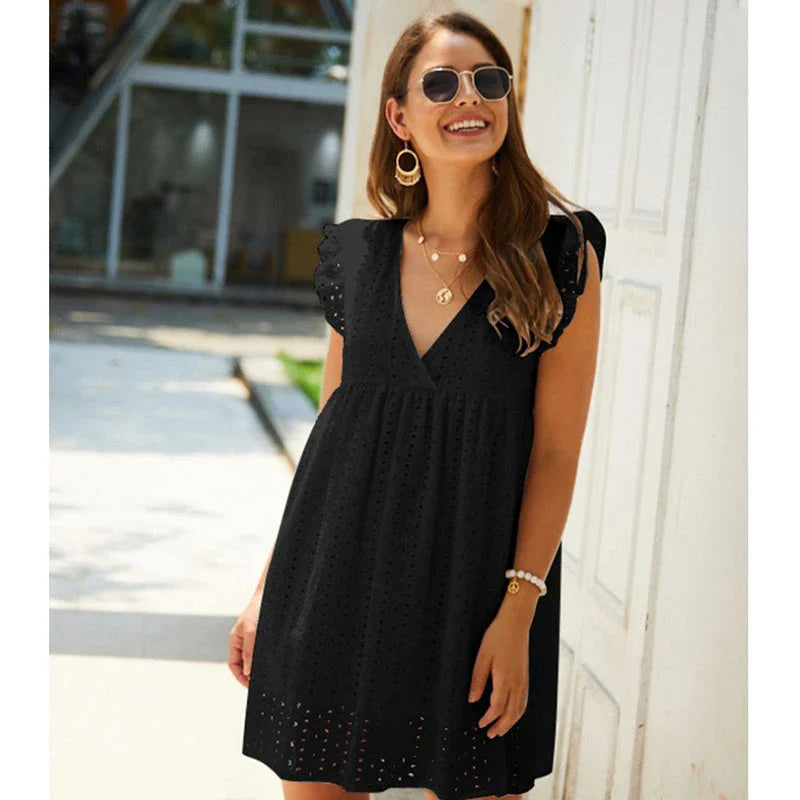 A stylish cotton mini dress with a v-neck and ruffled sleeves, perfect for summer days and nights.