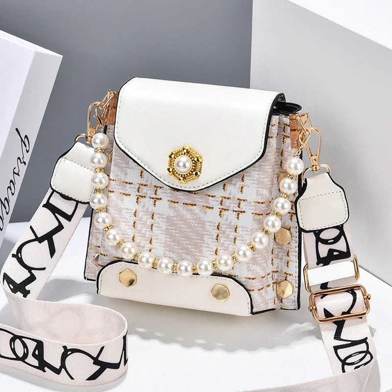 Premium crossbody phone bag with elegant pearl charm, made of durable PU leather and available in multiple color options