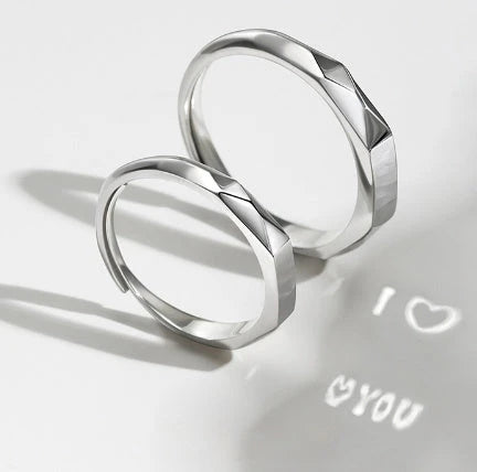 Stylish sterling silver rings with a hidden love pattern design, perfect for romantic gifts or personal accessorizing.