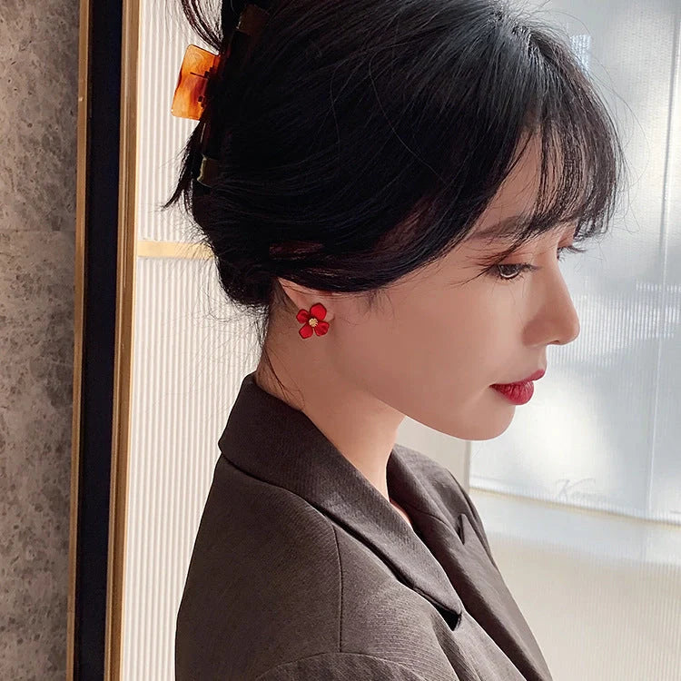 Elegant silver earrings with delicate red petal design inspired by Korean fashion