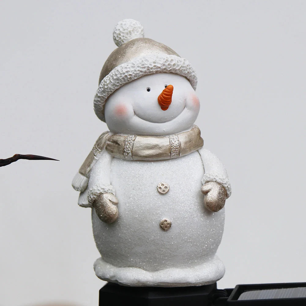Solar-powered snowman garden light with automatic dusk-to-dawn illumination