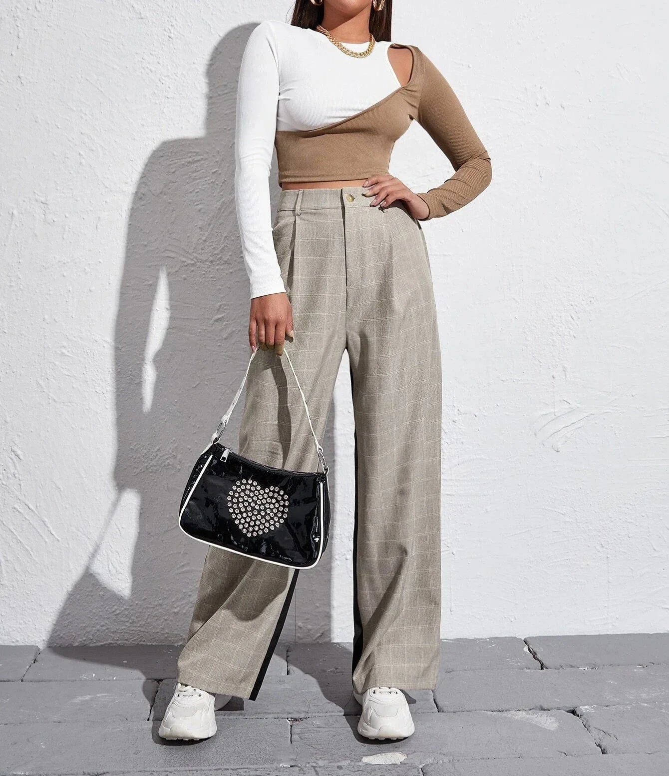 Stylish strapless cropped t-shirt in a trendy colorblock design, perfect for elevating any casual outfit.