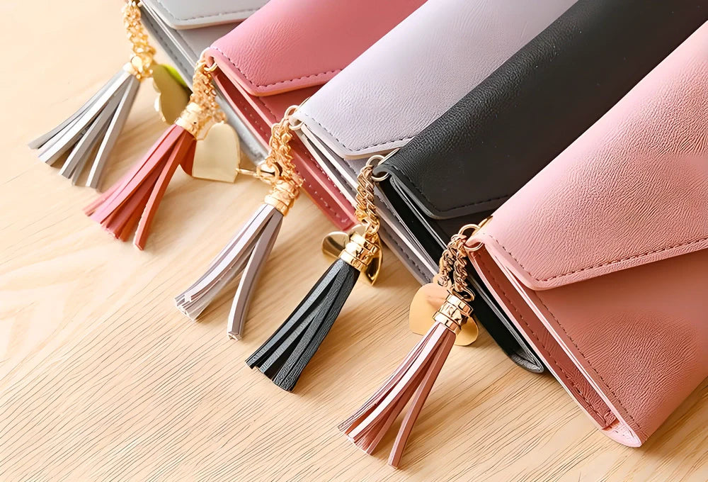 GEONYIEEK™ Women's Long Leather Wallet in various colours, featuring a sleek design, decorative tassel, and multiple storage compartments