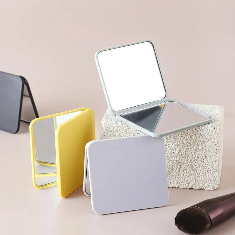 Portable Folding Double-Sided Makeup Mirror in Blue, Pink, Black, and Silver Colours