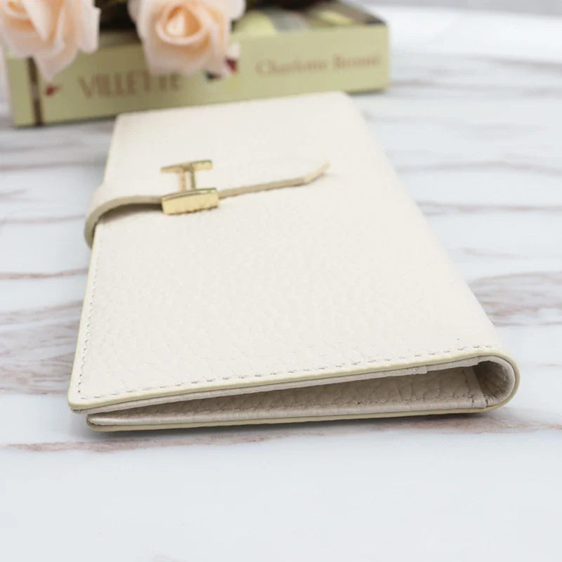 A stylish and practical long wallet made from premium leather, featuring a convenient drawstring closure to keep your essentials organised and secure.