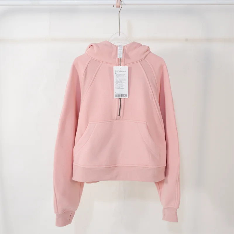 Premium women's sports fleece hoodie with half zip, available in a range of sophisticated colours