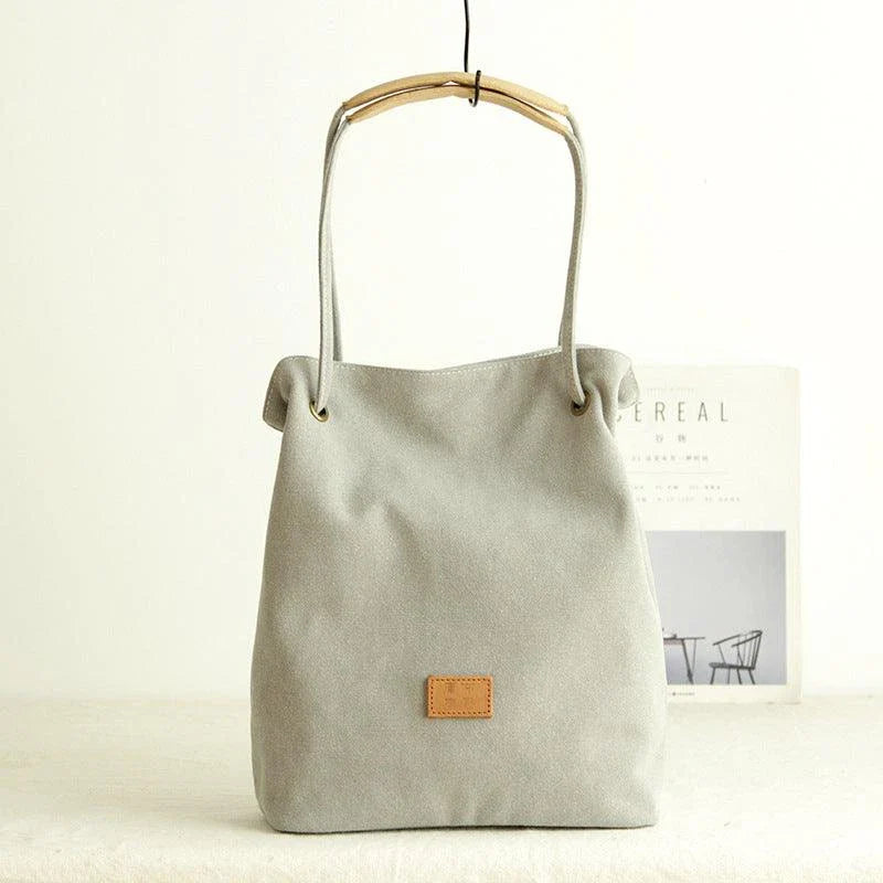 Premium canvas lattice shoulder bag in various colours, featuring a spacious design with secure zipper closure and adjustable strap for comfortable everyday carry