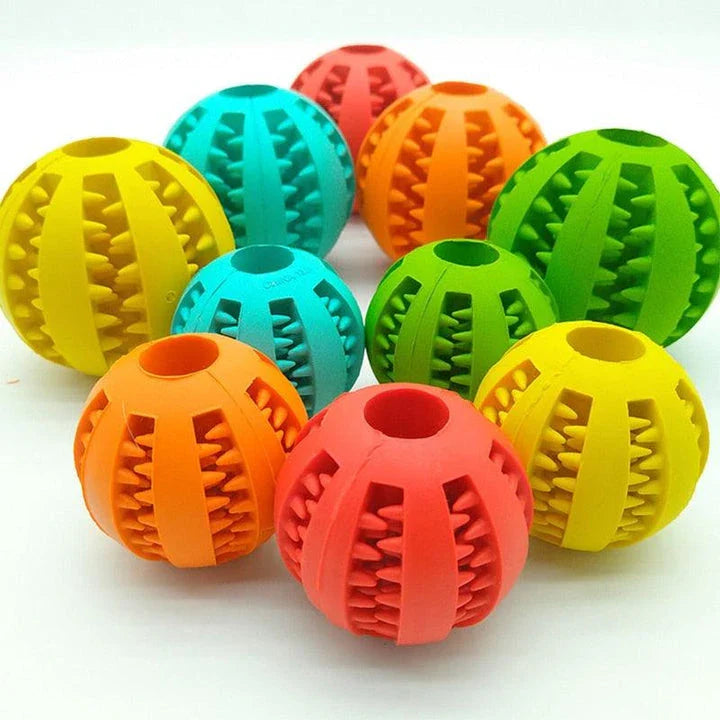 Premium natural rubber interactive ball for dogs in various colours, designed to provide mental stimulation and physical exercise.