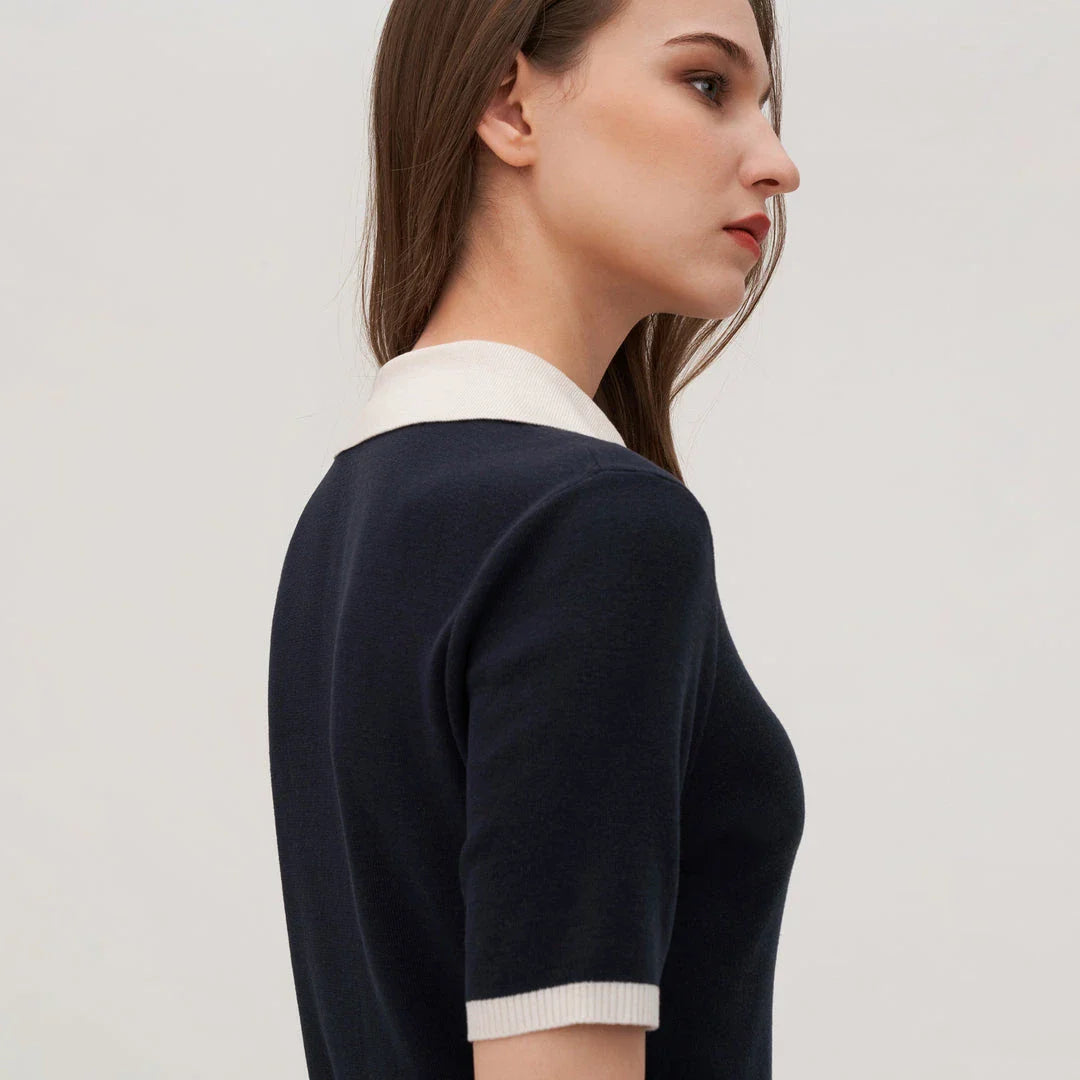Stylish silk knit polo shirt in navy blue, featuring a slim fit design, contrasting trim, and a feminine v-neckline for refined British elegance.
