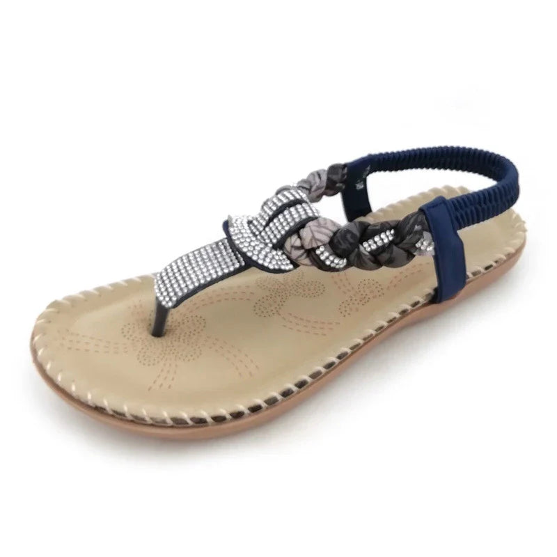 Stylish low-top toe sandals with two-layer leather upper, raw rubber sole, and rhinestone embellishments for chic British fashion