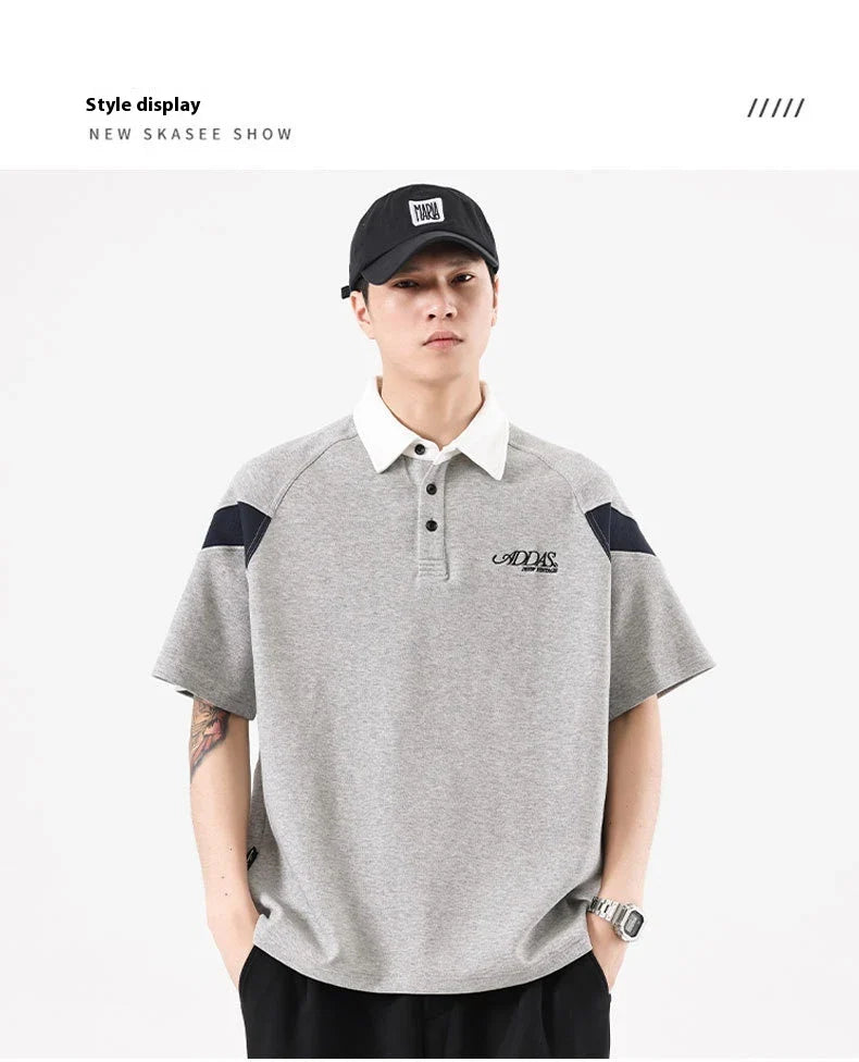 Melange grey polo shirt with contrast stitching, designed and made in Britain for comfortable summer wear
