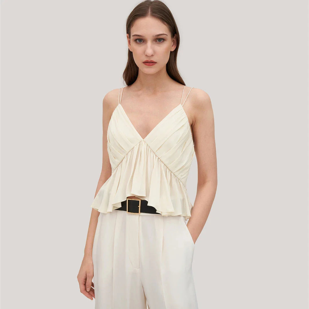Elegant and refined silk camisole with V-neck design and delicate spaghetti straps, perfect for the modern British fashion enthusiast