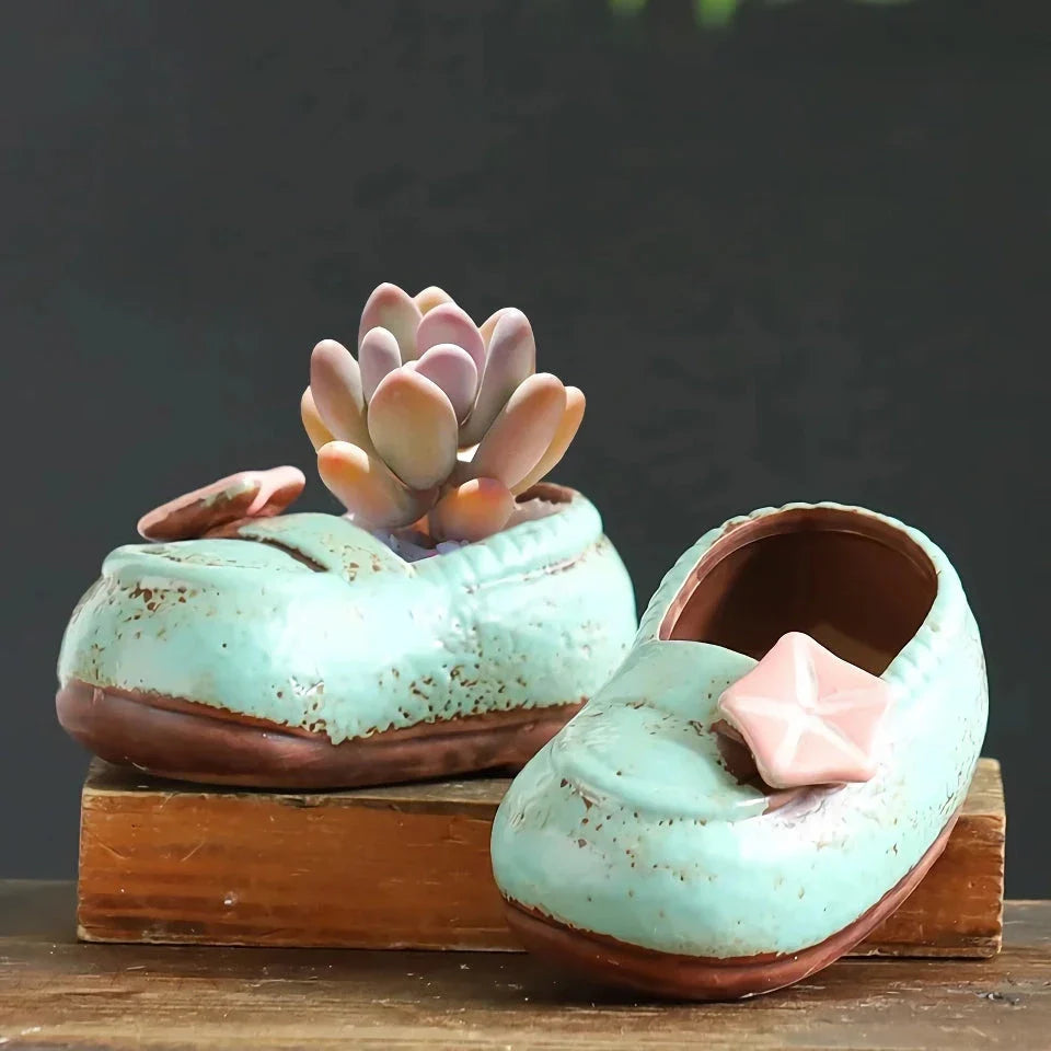 Charming ceramic boot-shaped vase with a glazed finish, perfect for displaying succulents and flowers in your home or garden