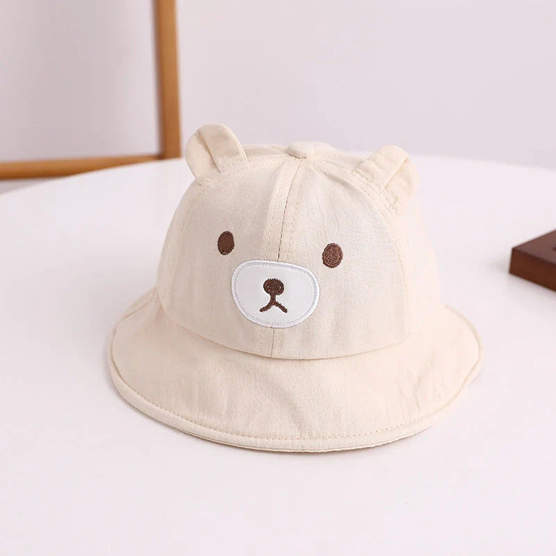Adorable kids' bear-themed panama bucket hat with soft, breathable fabric and adjustable fit for sun protection and style