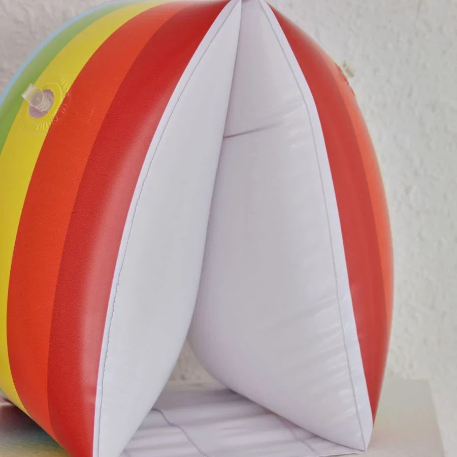 Vibrant inflatable pool floats in rainbow colours for adventurous children to enjoy water play safely