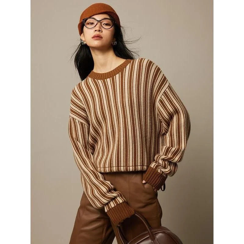 A chic striped wool-blend jumper in black, featuring an elegant O-neck design and a relaxed, flattering fit