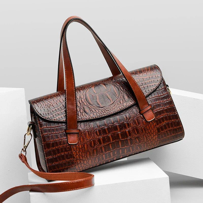 Premium crocodile pattern leather shoulder bag in multiple colours, featuring a pillow-shaped design for comfortable carrying and multiple interior pockets for organisation.