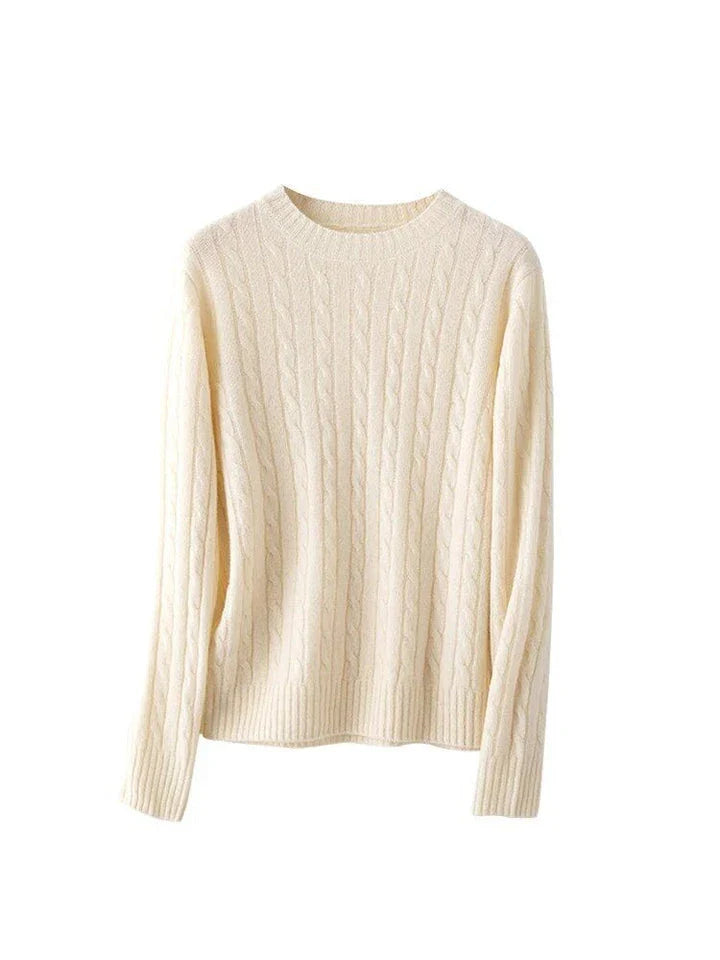 A luxurious 100% British wool cable knit jumper in a rich camel colour, perfect for keeping warm during the UK's chilly winters.