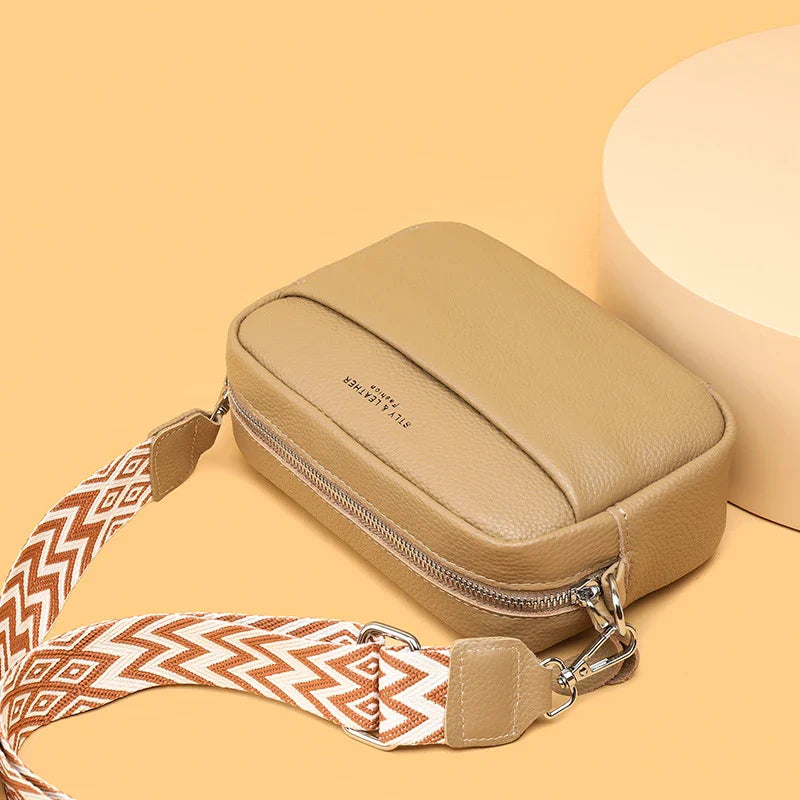 Stylish leather crossbody bag with embroidered strap in various colours
