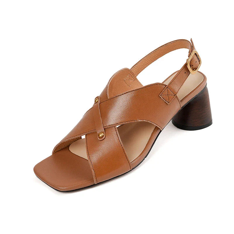 Elegant leather high heel sandals for women, featuring a refined square heel, stylish buckle strap, and sleek design for a sophisticated look.